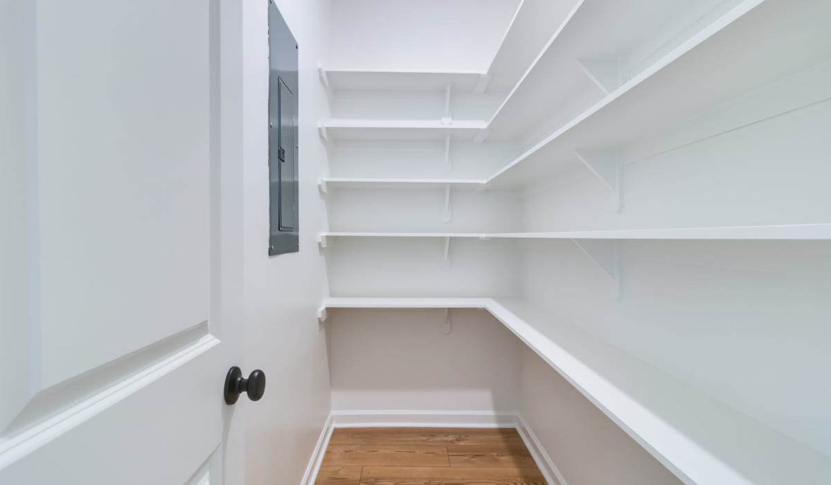 Spacious walk-in closet in a model home at Cottages at Sugar Mill Pond in Youngsville, Louisiana