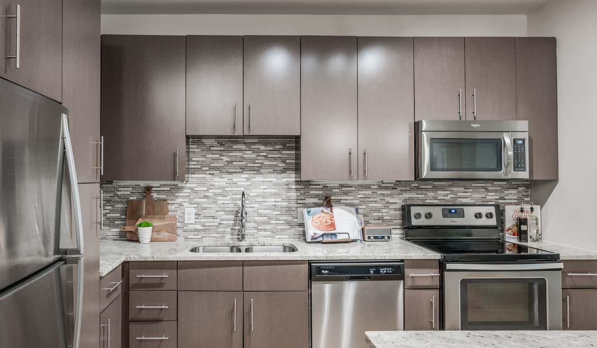 Kitchen with stainless-steel appliances at Tate Tanglewood in Houston, Texas