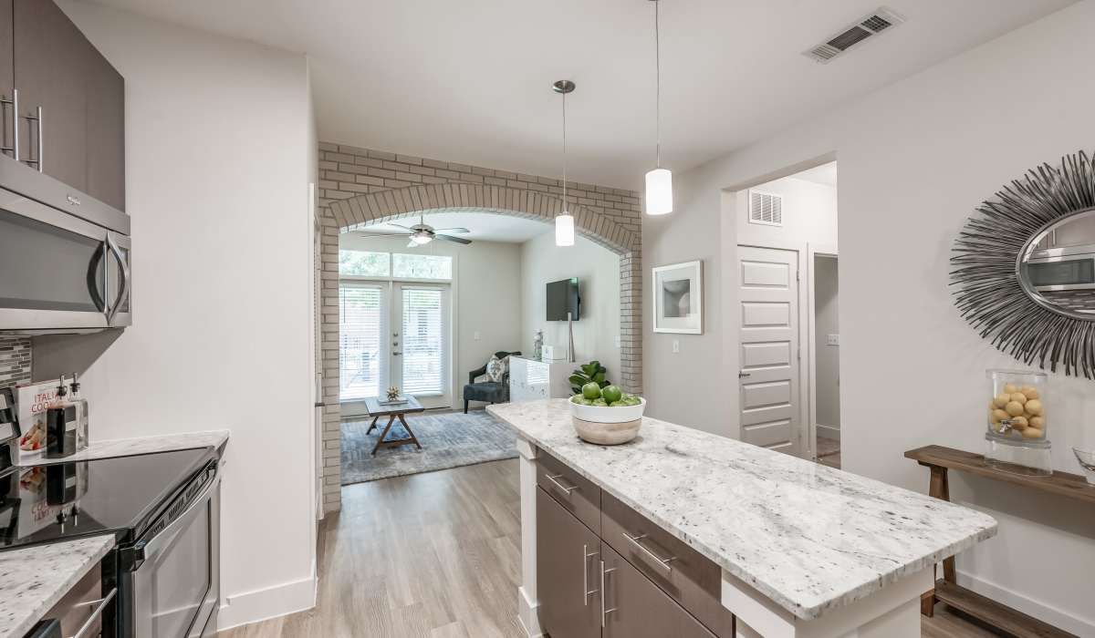 Spacious kitchen with island at Tate Tanglewood in Houston, Texas