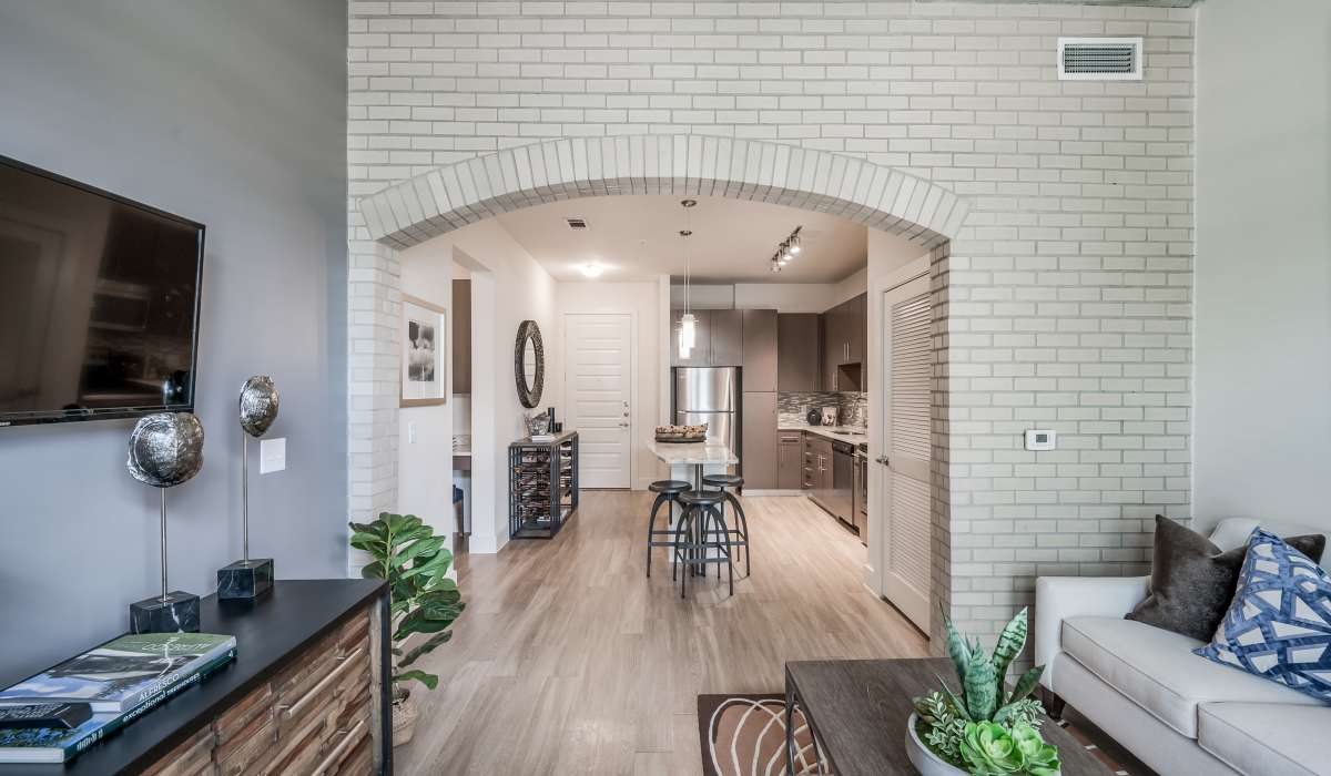 Spacious living room with wood-styled flooring at Tate Tanglewood in Houston, Texas