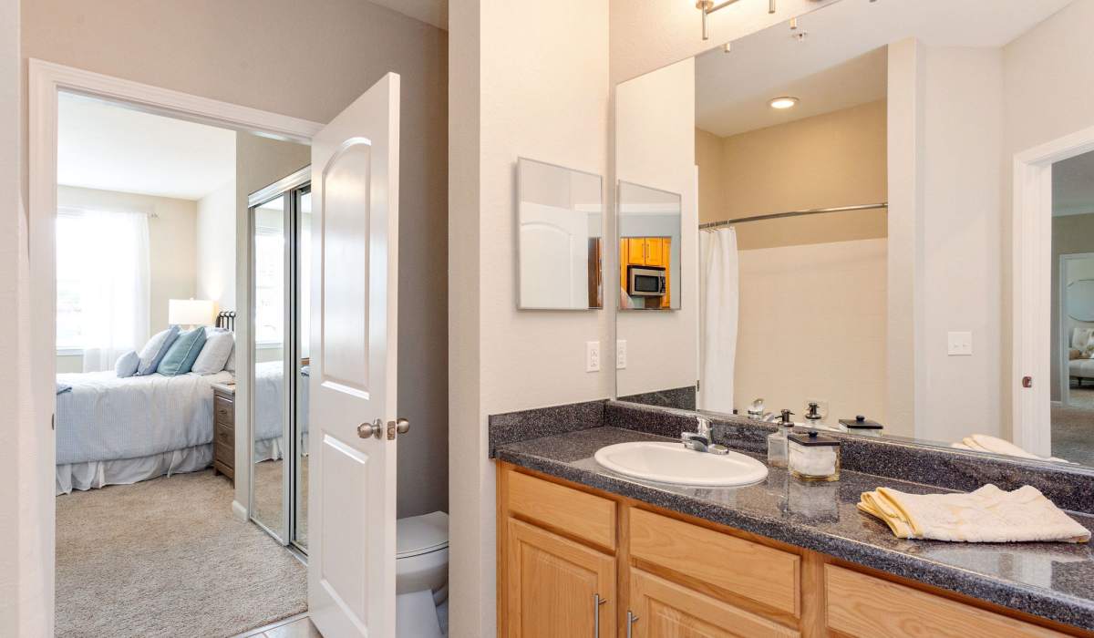 Washroom with vanity mirror at Arch Street in Madison, Alabama