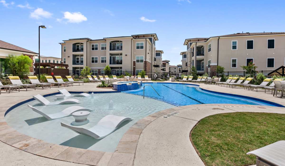 Pool area with lounge seating at Sadler House in San Marcos, Texas, 