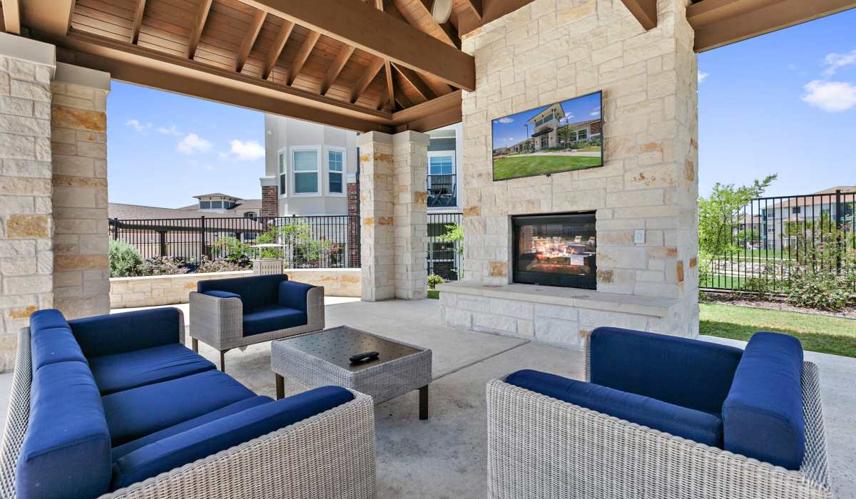 Lounge area with fireplace at Sadler House in San Marcos, Texas, 