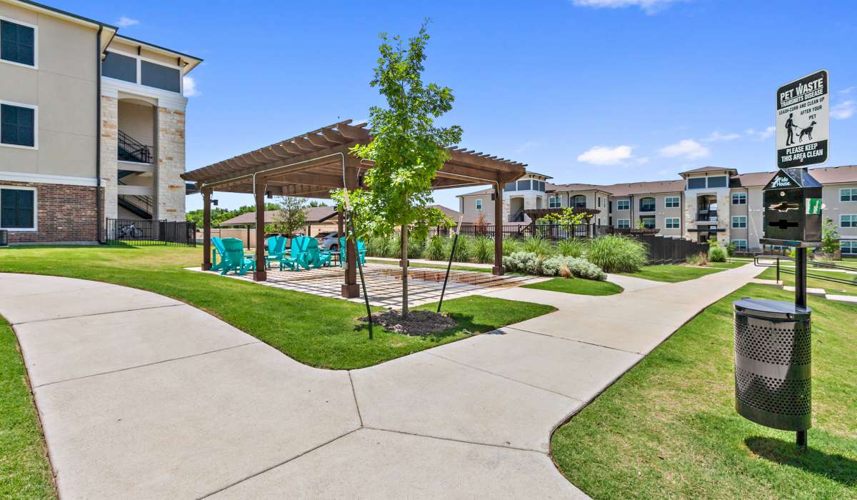 Lots of grass and walking paths near swimming pool at Sadler House in San Marcos, Texas, 