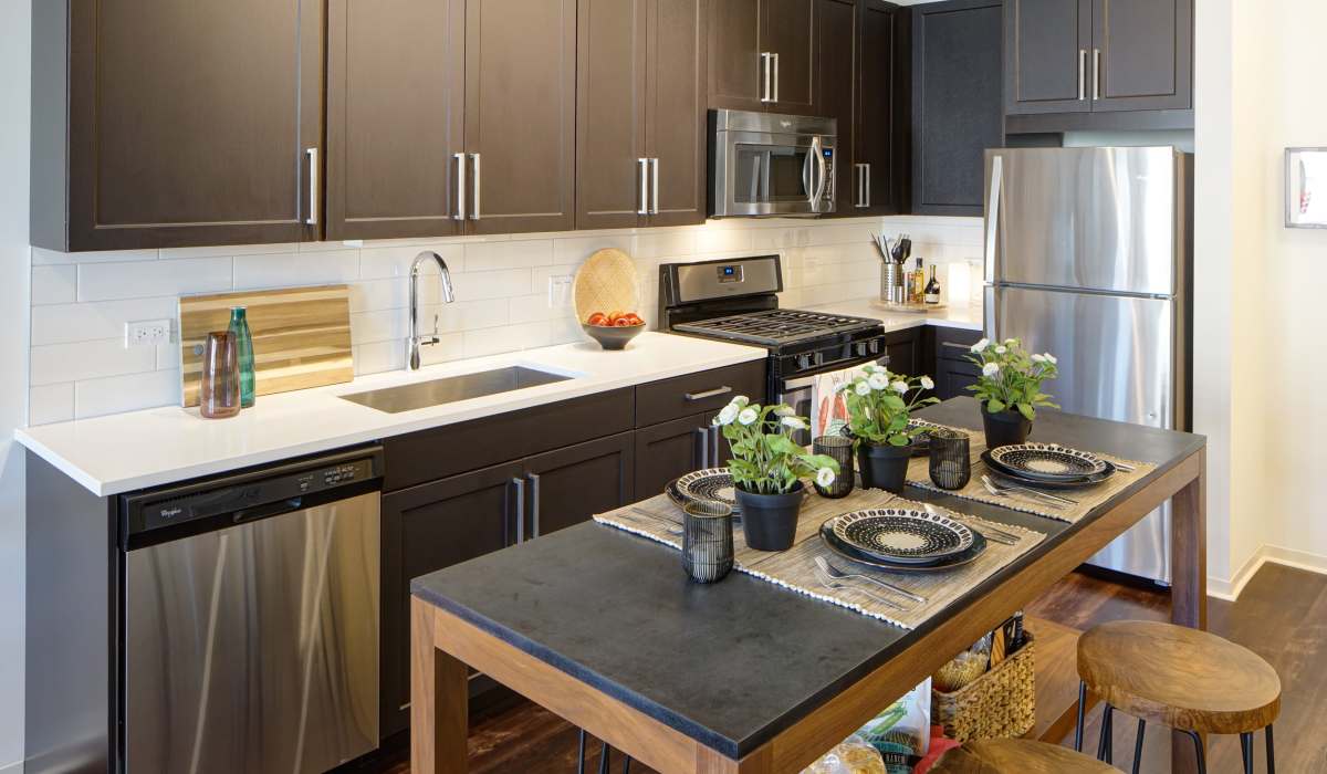 kitchen with island at Courthouse Square Apartments in Wheaton, IL