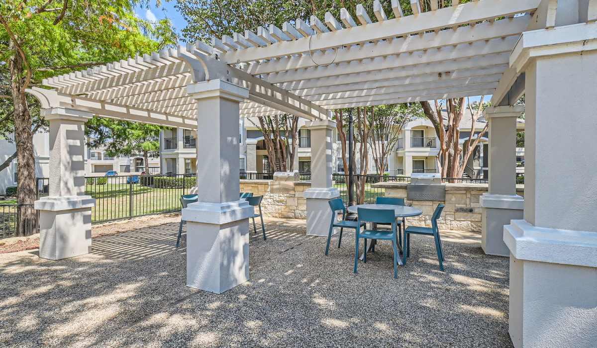 Sitting area by the community swimming pool at Wildwood Creek in Grapevine, Texas