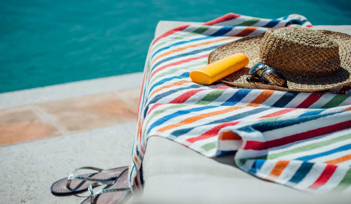 Resident's towel and hat next to the pool at Wynnwood at Freedom Road in Cranberry Township, Pennsylvania