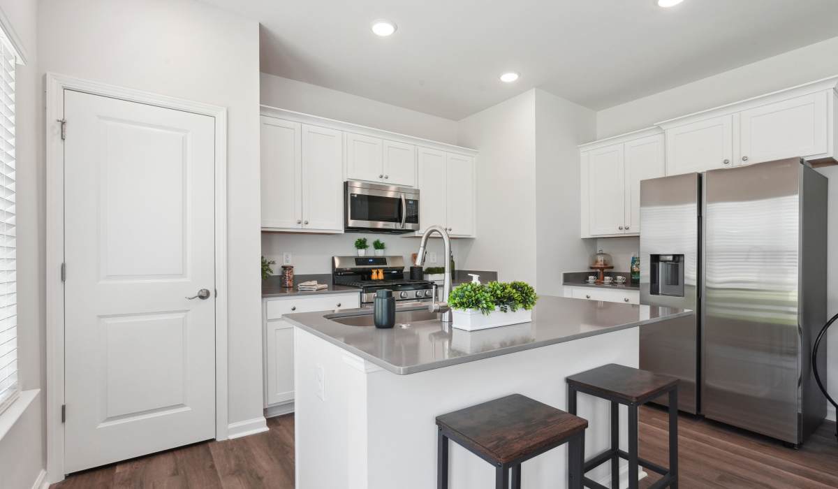 Modern kitchen with granite countertops at Reve Park Ridge in Little River, South Carolina