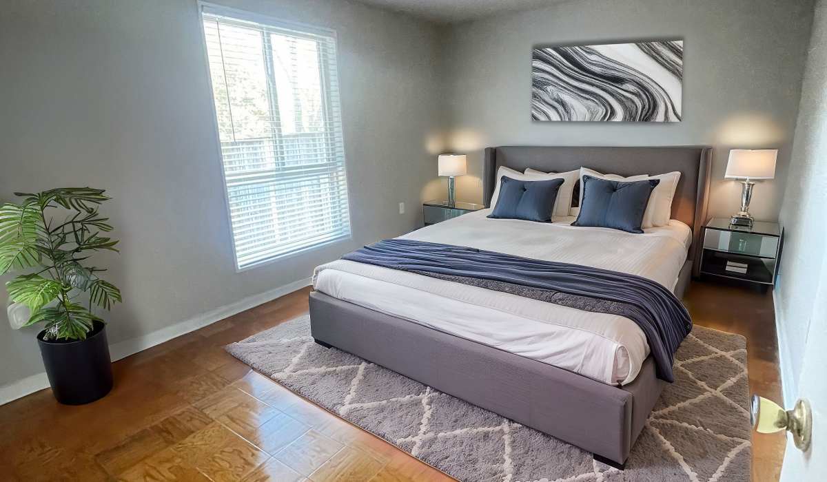 apartment bedroom with a desk in it at Towne Crest in Gaithersburg, Maryland