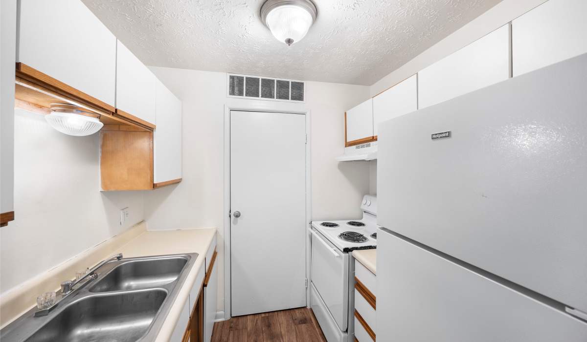 Model apartment kitchen with natural granite-stone countertops at Pleasant Run Apartments in Cincinnati, Ohio