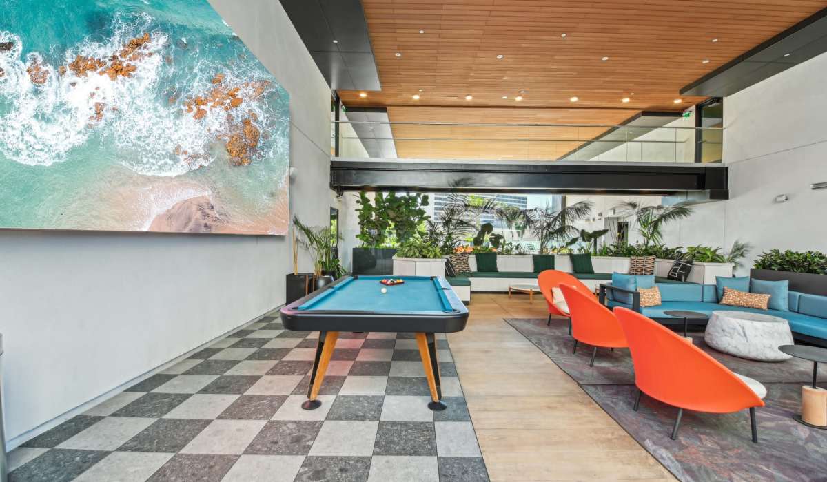 Recreation area with chairs and tables at Aster in Long Beach, California