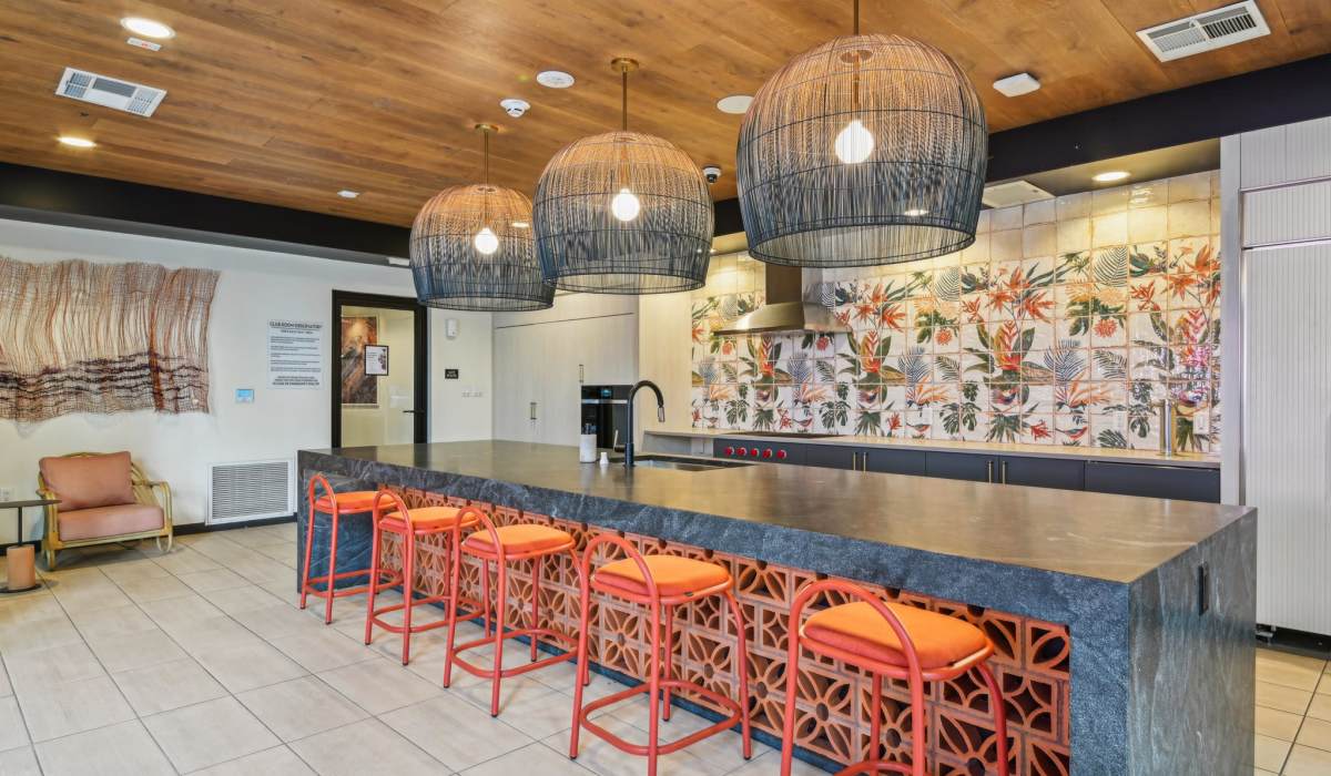 Indoor pantry area with long island bar and chairs at Aster in Long Beach, California