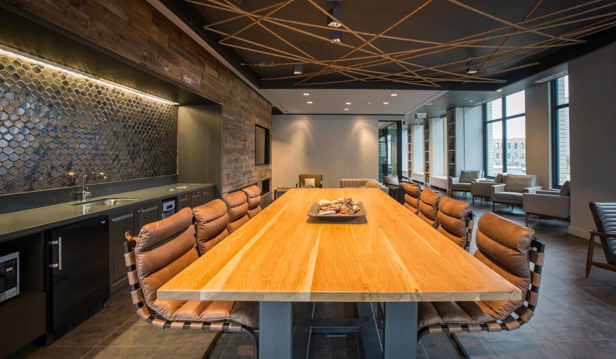 Large meeting table in the clubhouse at Exhibit On Superior in Chicago, Illinois