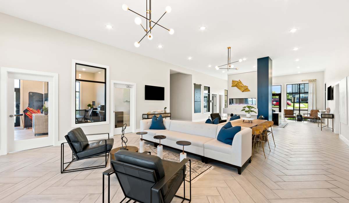 Clubhouse living room with couch, chairs and table at Elevate at Topside in Louisville, Tennessee