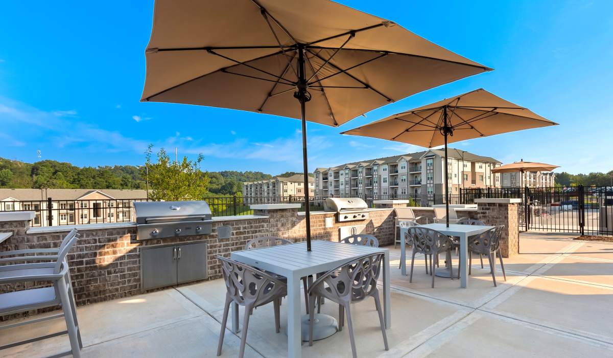 Seating area with barbeque grill at Elevate at Topside in Louisville, Tennessee
