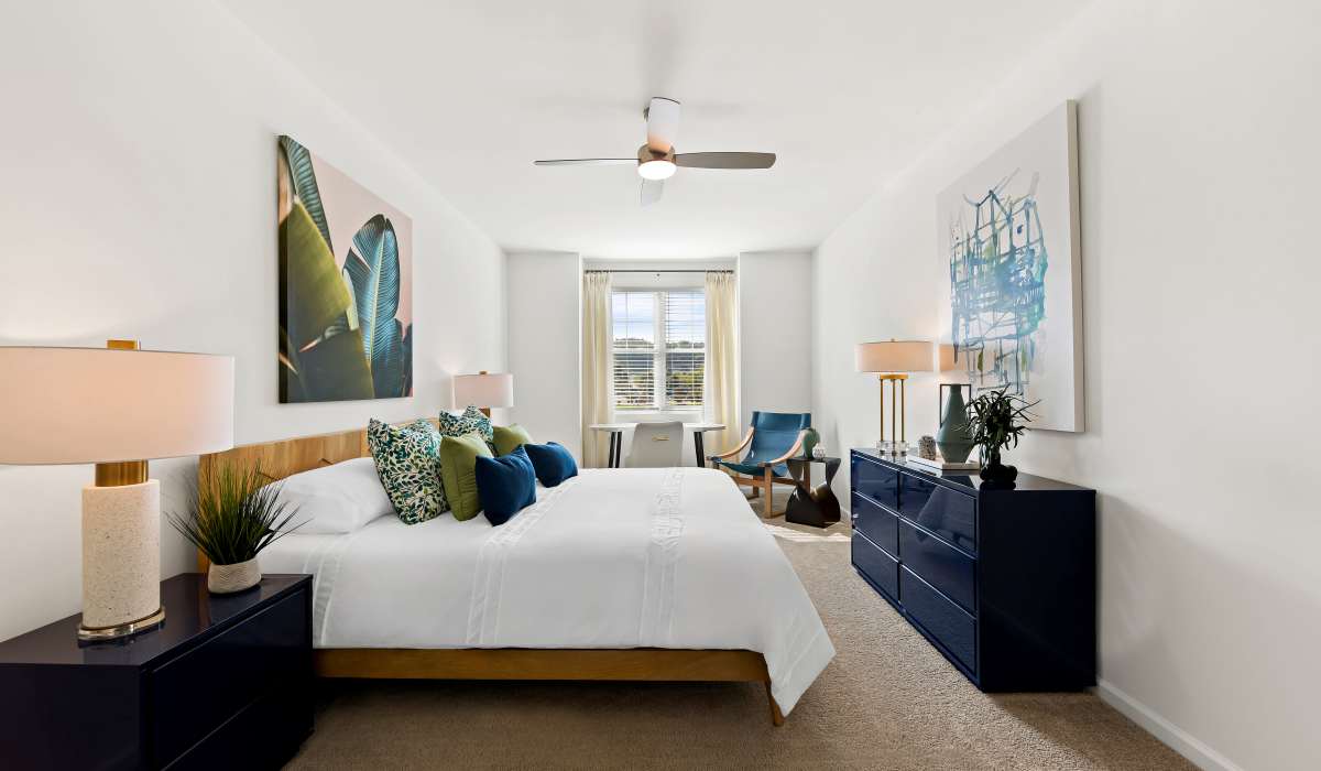 Spacious bedroom with ceiling fan and window at Elevate at Topside in Louisville, Tennessee