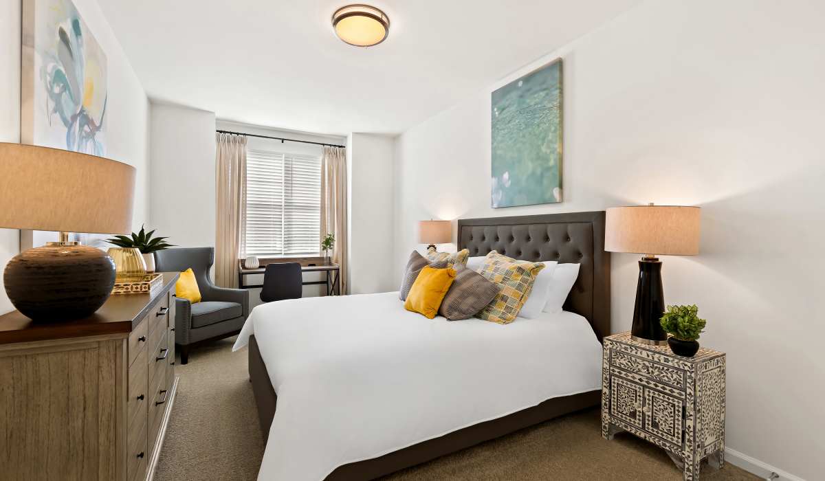 Bright bedroom with night stand, windows at Elevate at Topside in Louisville, Tennessee