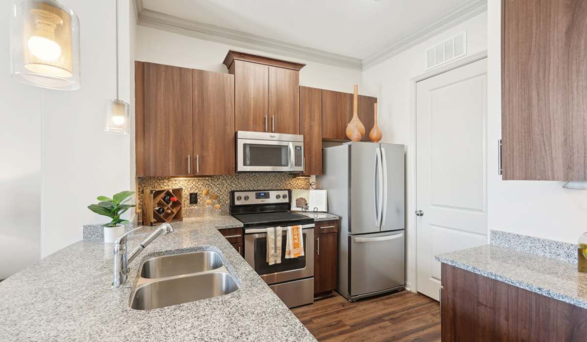 Kitchen with stainless-steel appliances at Mark at West Midtown in Atlanta, Georgia