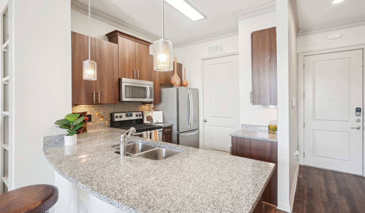 Kitchen with stainless-steel appliances at Mark at West Midtown in Atlanta, Georgia