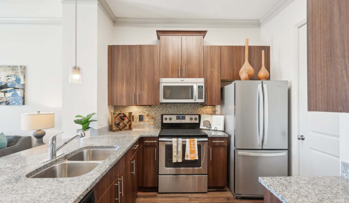 Kitchen with stainless-steel appliances at Mark at West Midtown in Atlanta, Georgia