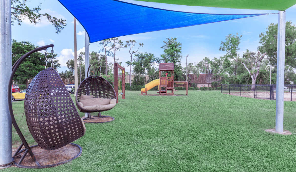 Hanging chairs by the playground at Fountains at Forestwood in Fort Myers, Florida