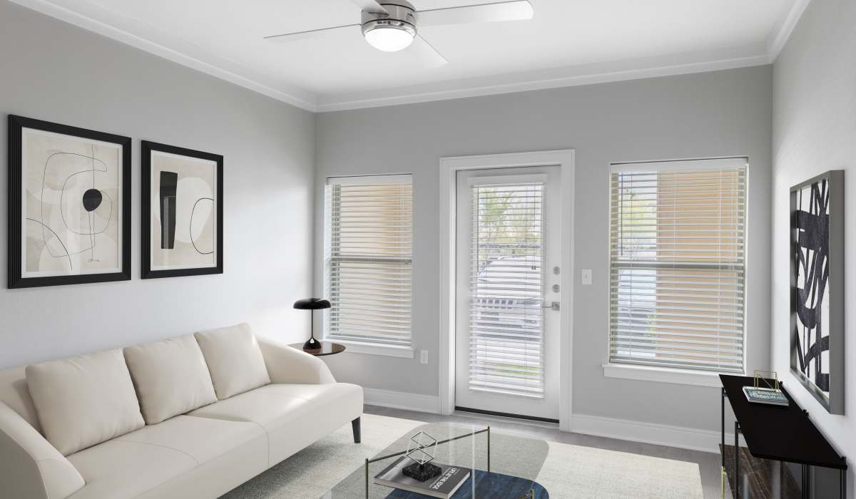 Spacious living room with large windows at Vale Overland Park Apartments in Overland Park, Kansas, 