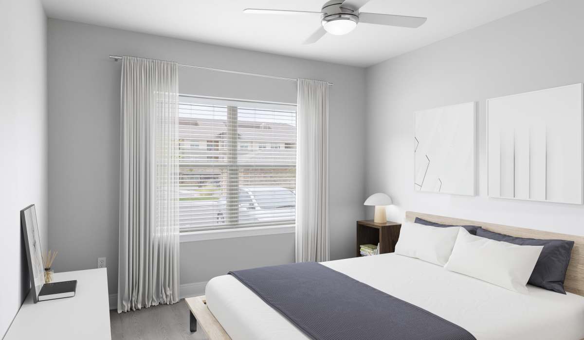 Spacious bedroom with ceiling fan at Vale Overland Park Apartments in Overland Park, Kansas,  