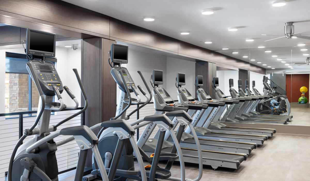 Fitness center with treadmills at Vale Overland Park Apartments in Overland Park, Kansas, 