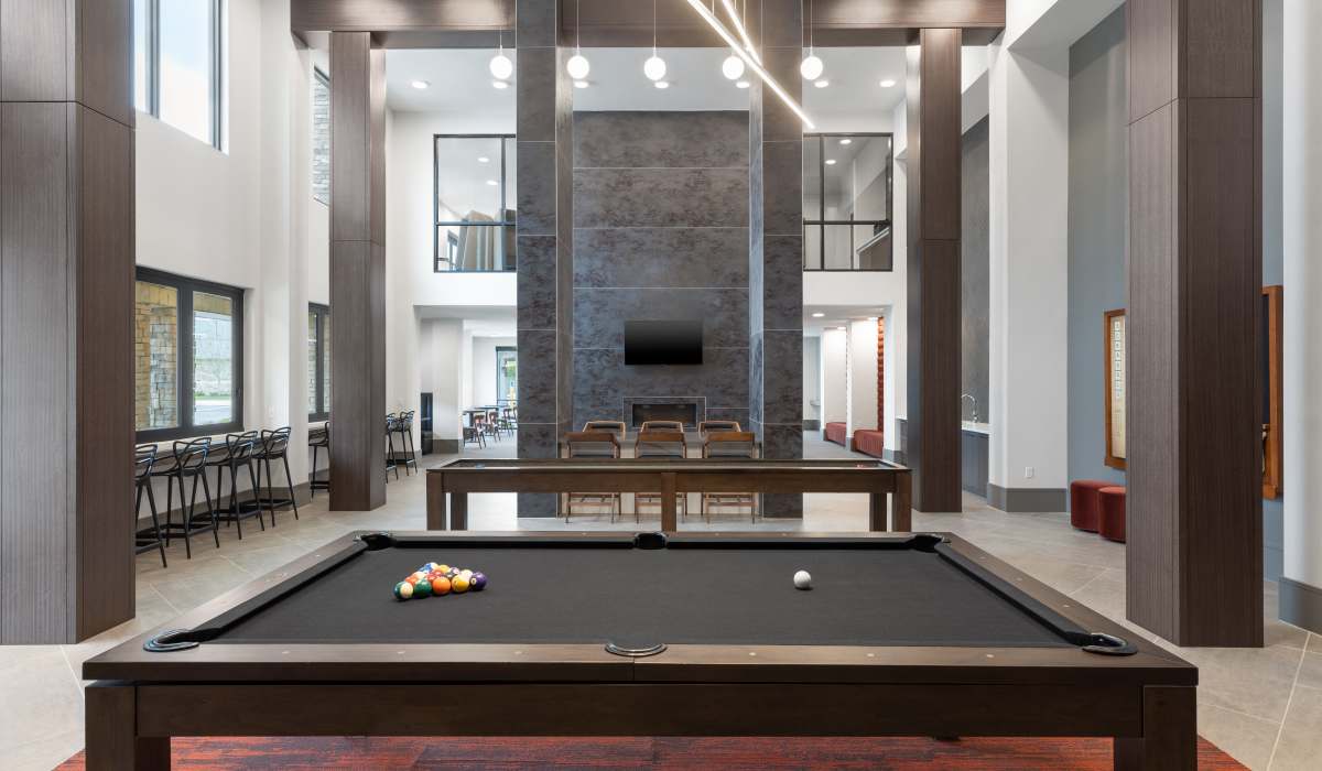Shuffleboard in the clubhouse at Vale Overland Park Apartments in Overland Park, Kansas, 