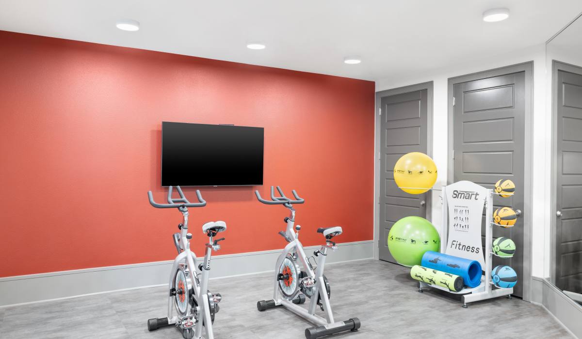 Fitness center at Vale Overland Park Apartments in Overland Park, Kansas, 