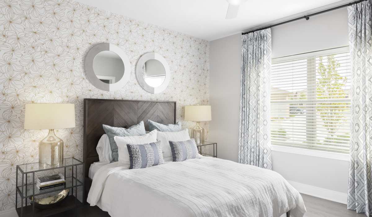 Bedroom with large windows at Vale Overland Park Apartments in Overland Park, Kansas, 