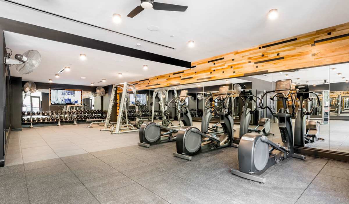 Fitness center with ceiling fan at Channel House in Raleigh, North Carolina