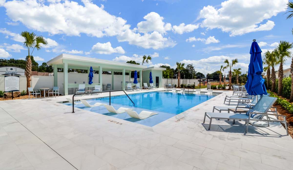 Resort-style pool with tanning deck at Trinity Villas in Lafayette, Louisiana