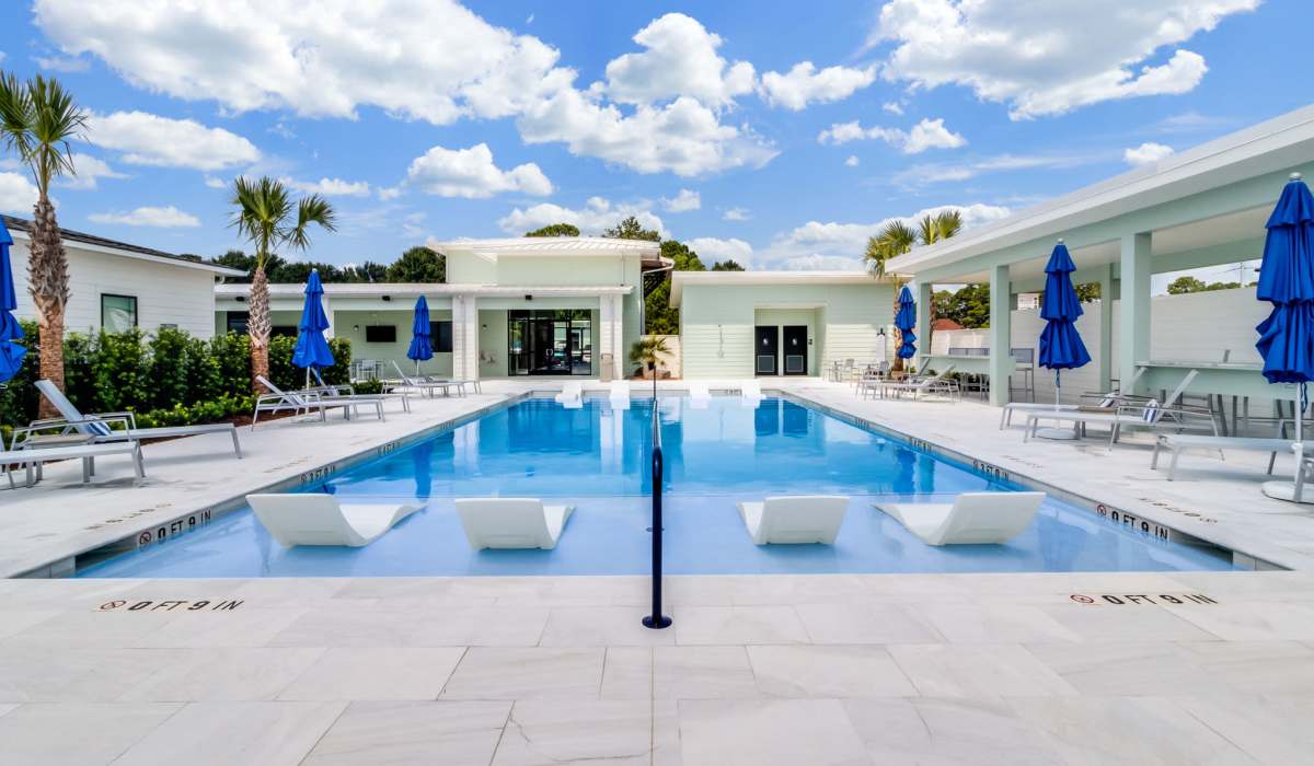 Community swimming with lounge seating at Trinity Villas in Lafayette, Louisiana