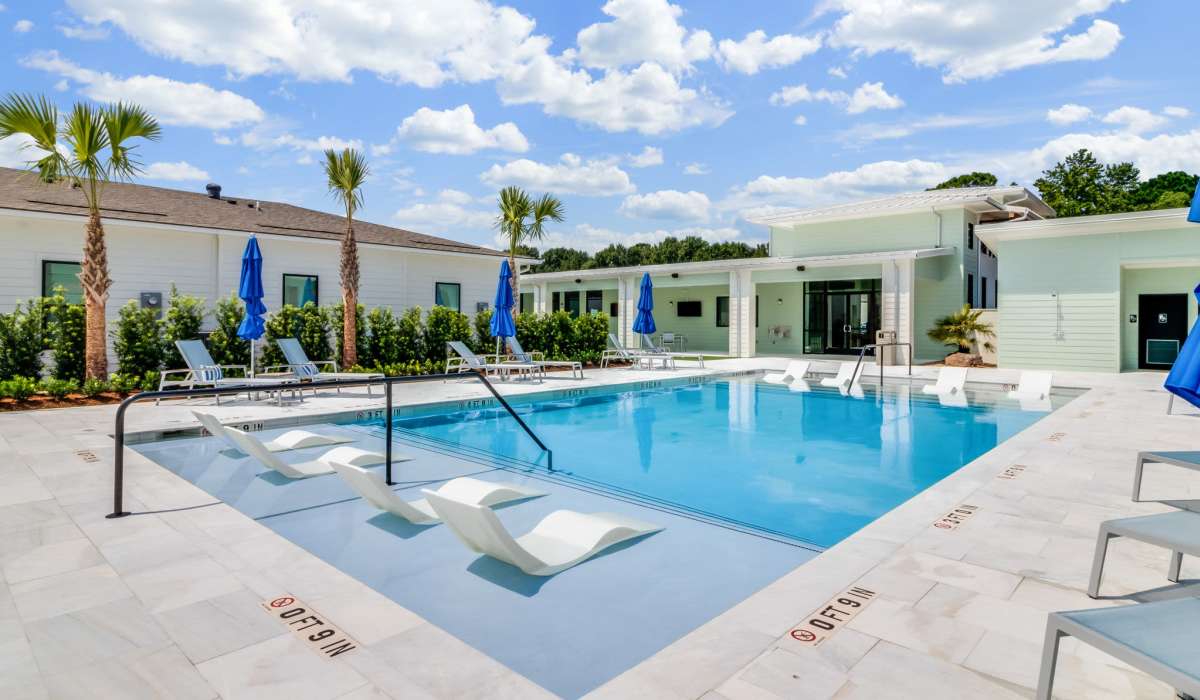 Swimming pool with sunlounger at Trinity Villas in Lafayette, Louisiana