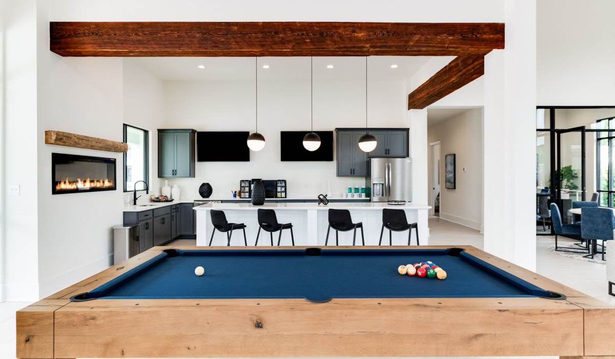 Clubhouse with pool table and community kitchen at Trinity Villas in Lafayette, Louisiana