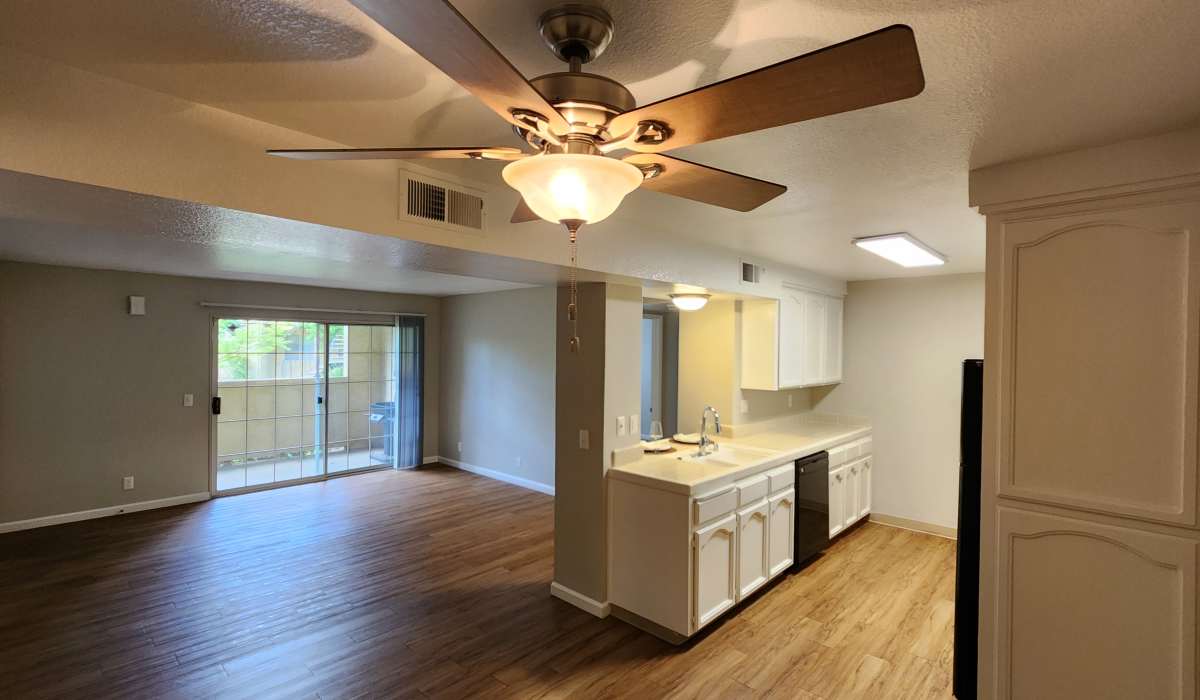 Living room with large window at Cobble Creek Apartment Homes in Chico, California
