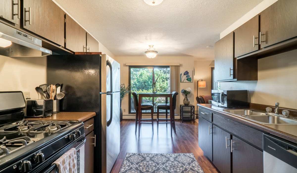 Kitchen and dining table at Cedars of Edina in Edina, Minnesota
