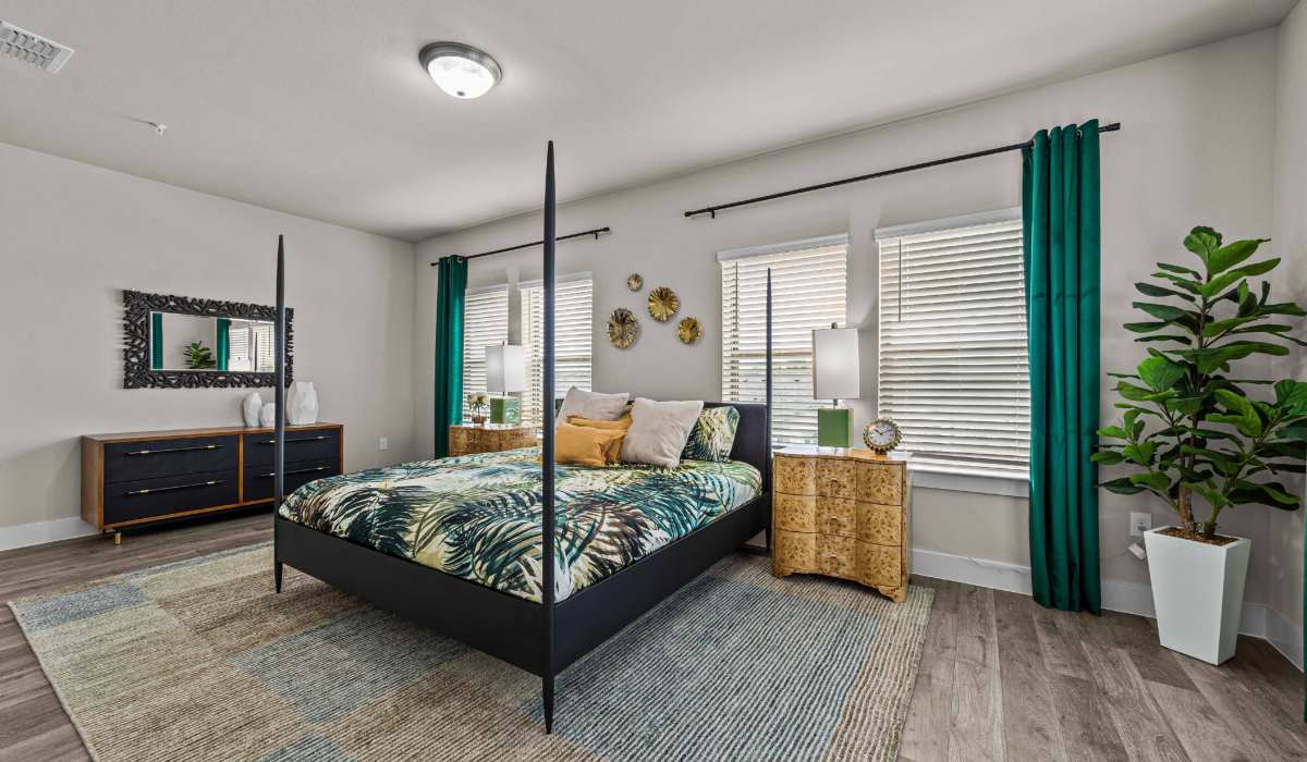 Spacious bedroom with large windows at Estates Of Mckinney in Mckinney, Texas