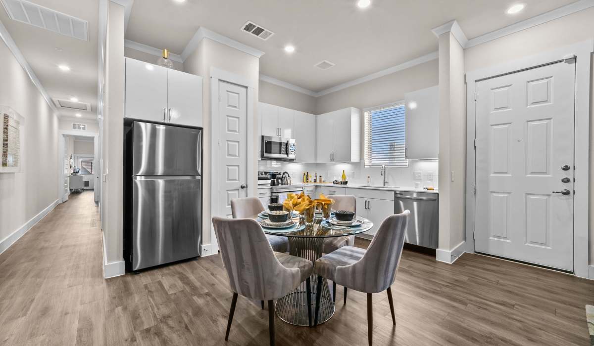Kitchen with stainless-steel appliances at The Luxe Of Mckinney in Mckinney, Texas