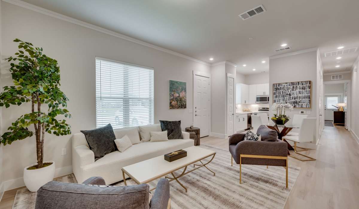 Living room in a home at The Luxe Of Prosper in Mckinney, Texas