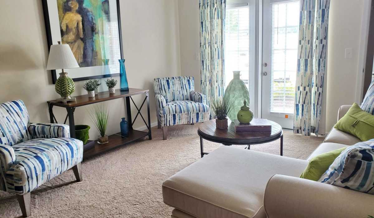 Spacious living room with natural lighting at Palisades at The Park in Greenville,South Carolina