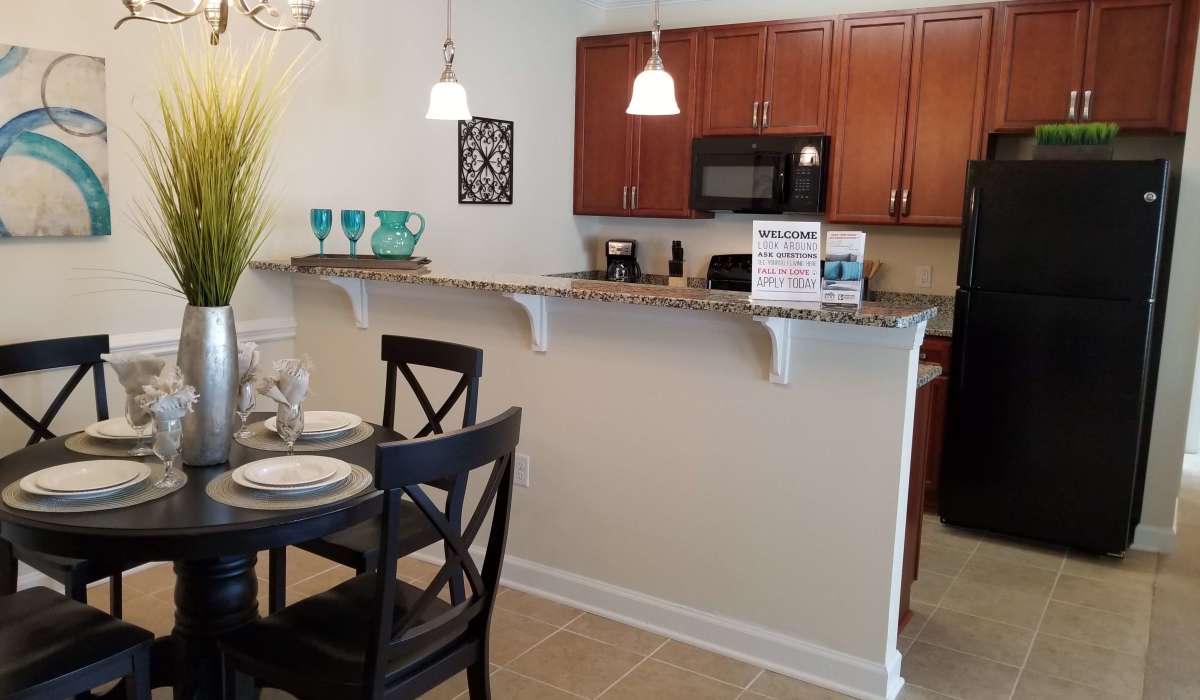 Dining room attached to fully equipped kitchen at Palisades of Fountain Inn in Fountain Inn, South Carolina, 