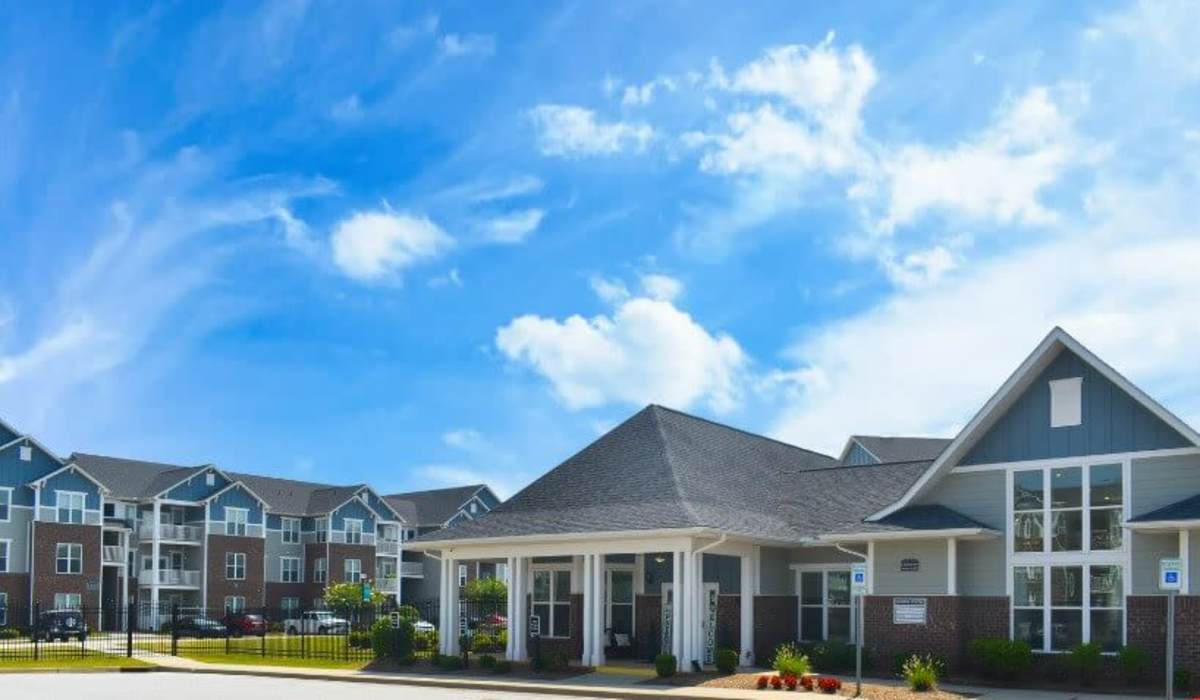 Community entrance with landscaped grounds at Palisades of Fountain Inn in Fountain Inn, South Carolina, 