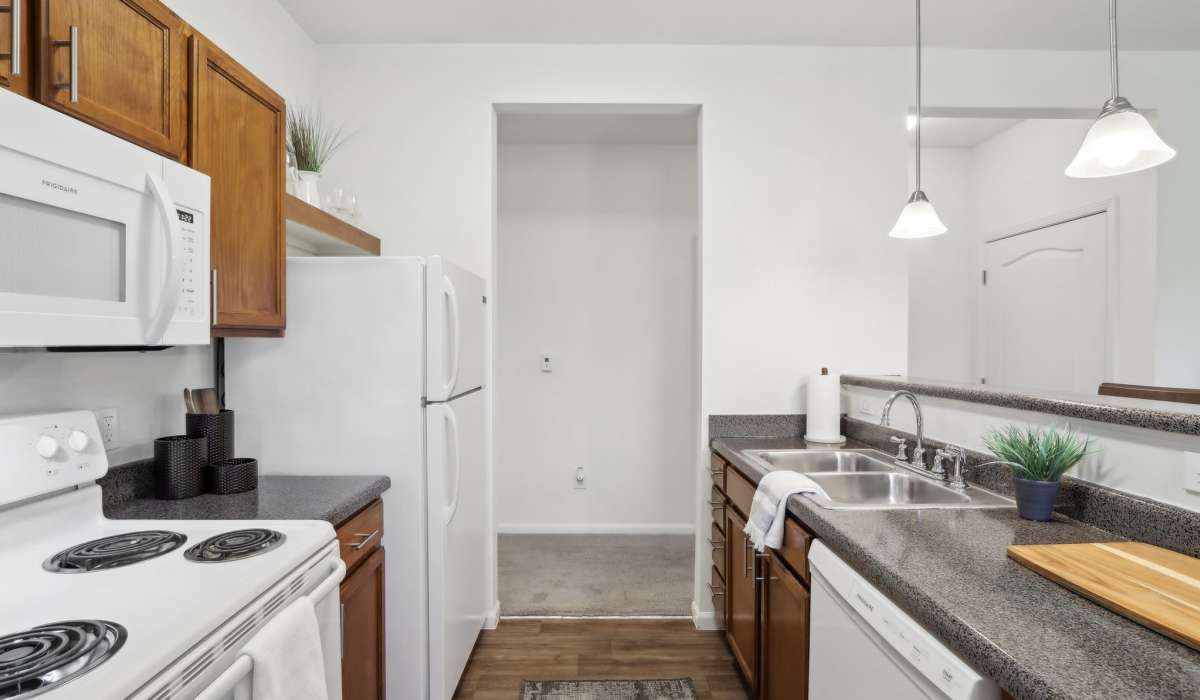 Apartment kitchen with white appliances at Bluestone in Greenfield,Indiana