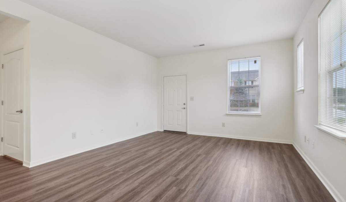 Unfurnished apartment bedroom with wood-style flooring at Bluestone in Greenfield,Indiana