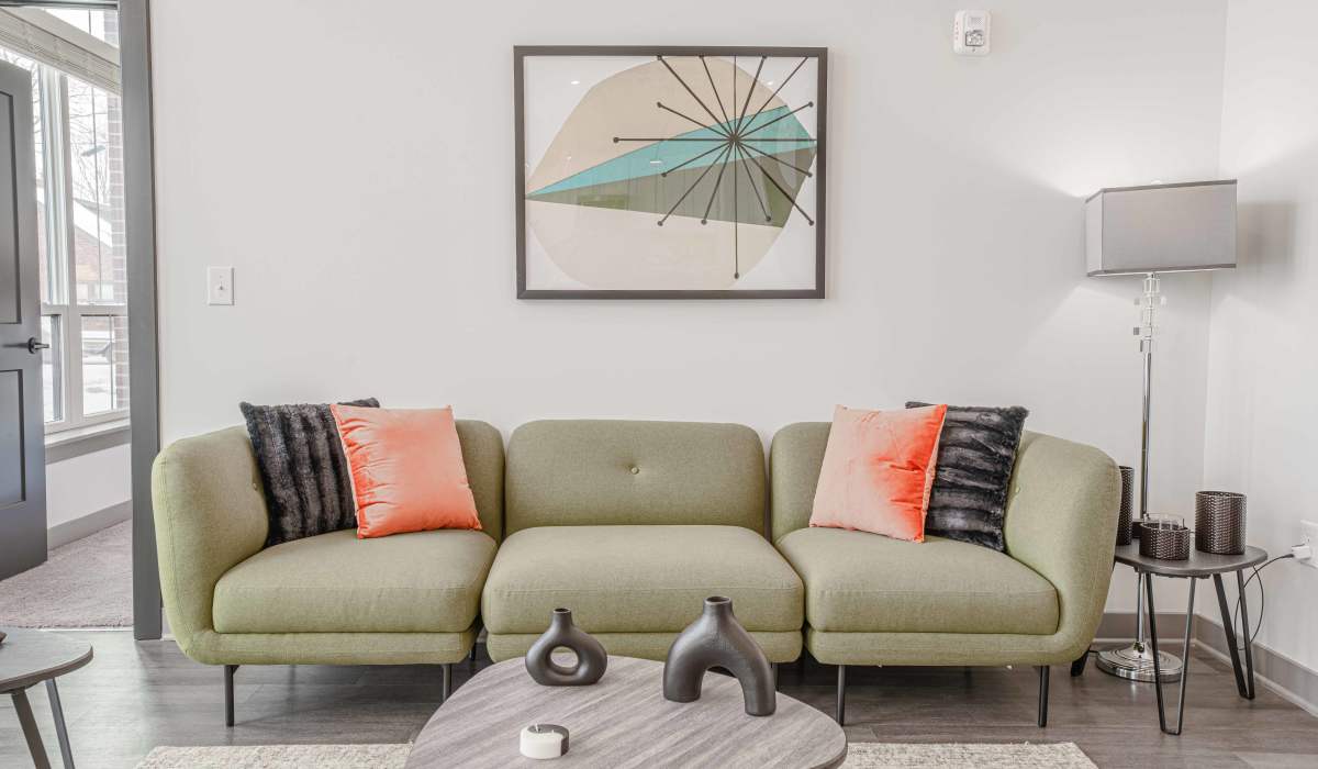 Living room with wooden flooring at The Apartments at 1st on Main in Carmel, Indiana