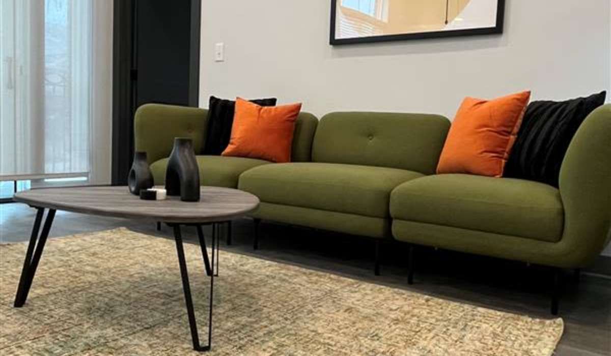 living room with coffee table at The Apartments at 1st on Main in Carmel, Indiana