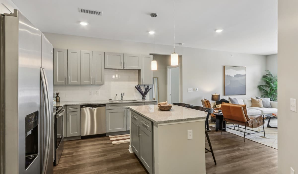 Kitchen with wooden cabinets and stainless-steel appliances at Founders Pointe Apartments in Franklin, Indiana