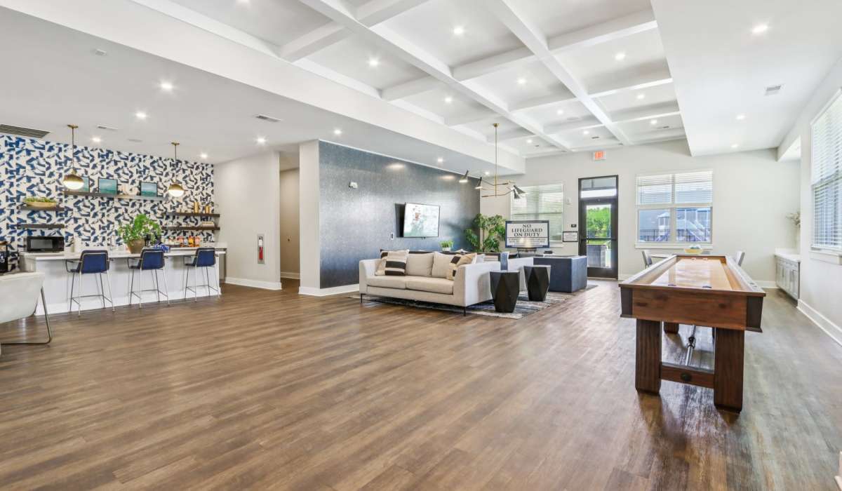 Spacious clubhouse with wooden flooring at Founders Pointe Apartments in Franklin, Indiana